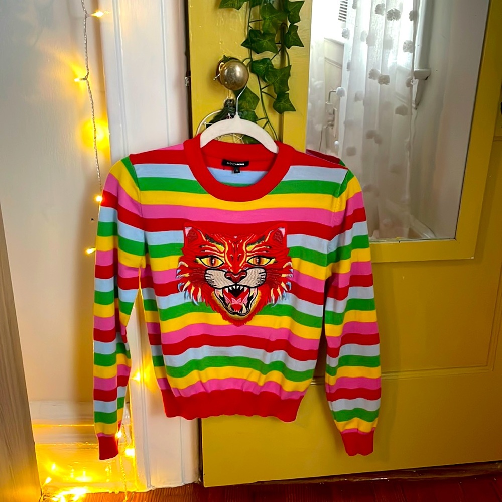 Funky striped sweater with funky animal on front. Very comfortable.